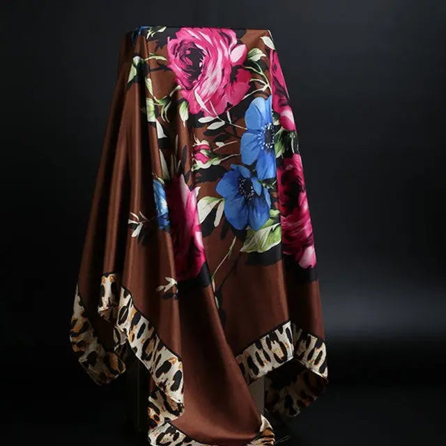 Elegant silk scarf featuring a stylish leopard print pattern, perfect for fashion-forward accessories.