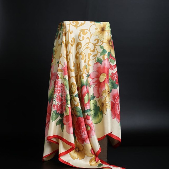 Elegant silk scarf featuring a stylish leopard print pattern, perfect for fashion-forward accessories.