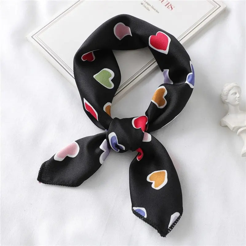Elegant silk scarf featuring a charming heart print, perfect fashion accessory for women seeking stylish looks.