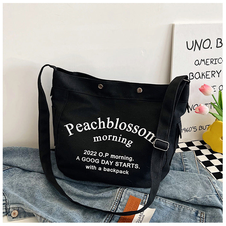 Letter canvas bag, women's new trendy tote bag, student class large capacity crossbody bag.