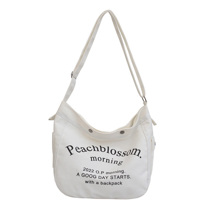 <img src="https://genacampbell.fr/images/le-croulebarbe-letter-bag.jpg" alt="Le Croulebarbe · Sac cabas Letter porté à l’épaule · Création Gena Campbell · Toile résistante & format A4 · Compartiments intérieurs pratiques · Bandoulière ajustable & poignées confortables · Coloris Beige, Noir ou Café · Style urbain & jeunesse studieuse · Idéal pour étudiante ou femme active">
