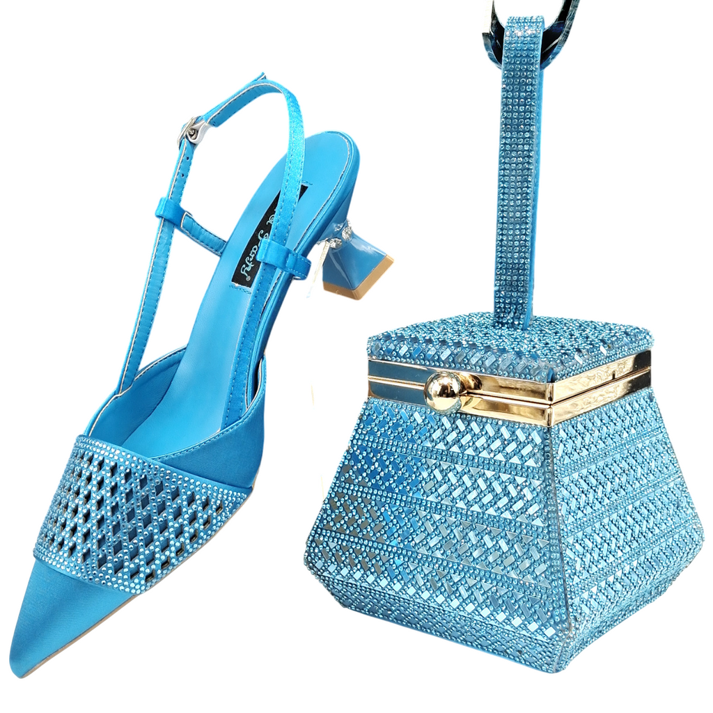 <img src="https://genacampbell.shop/images/le-ranelagh-escarpins-sac-coordonne.jpg" alt="Le Ranelagh · Ensemble escarpins sculptés à bout pointu & sac rigide coordonné · Création Gena Campbell · Talon ≈9 cm sculpté style coupe verre · Satin synthétique brillant · Sac avec fermoir bijou et anse rigide · Pointures 38 à 43 · Coloris : bleu ciel, or, vert, orange, pêche, rouge, argent · Élégance affirmée & finition soirée pour silhouette structurée">